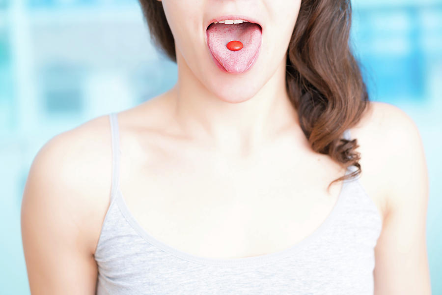 Female Photograph - Woman With Red Pill On Tongue by Wladimir Bulgar/science Photo Library