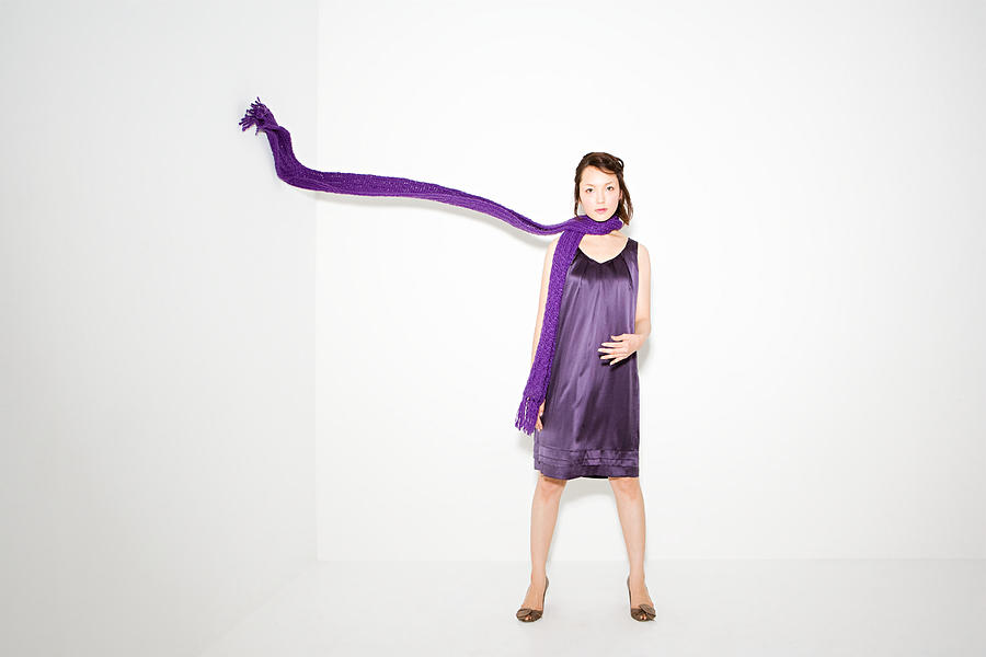 Woman with scarf in mid air Photograph by Image Source