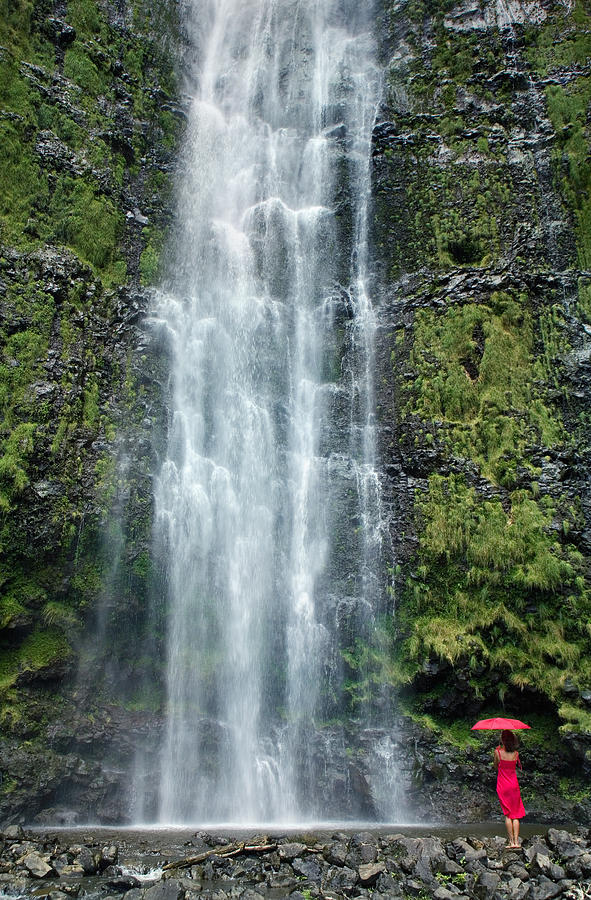 Woman with umbrella at Wailua Falls Photograph by M Swiet Productions