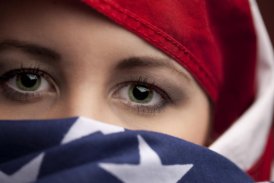 Woman wrapped in an American Flag Photograph by Inhauscreative