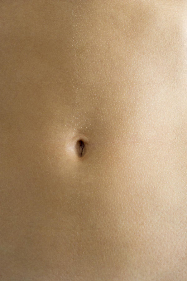 Womans navel, close-up Photograph by PhotoAlto/Frederic Cirou