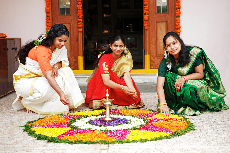 Women arranging a floral decoration Photograph by Visage