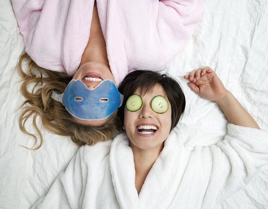 Women in bathrobes wearing eye masks Photograph by Dirk Lindner