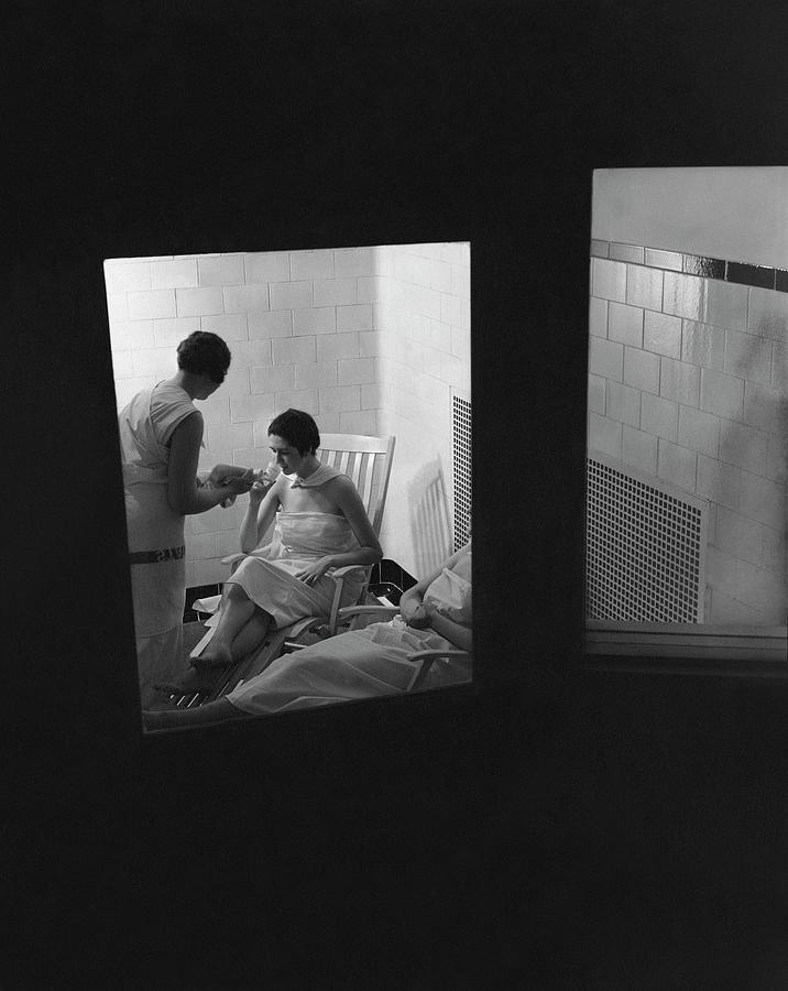 Women Relaxing In A Hot Room Photograph by Lusha Nelson