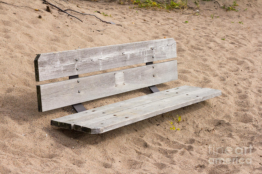 Wooden bench burried in the sand Photograph by Les Palenik