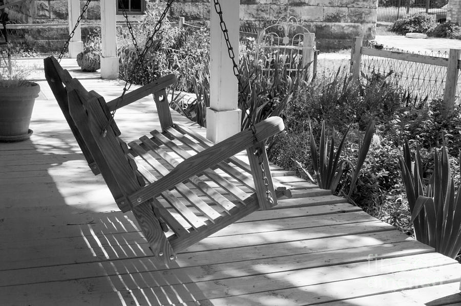 Wooden front porch swing Photograph by Imagery by Charly