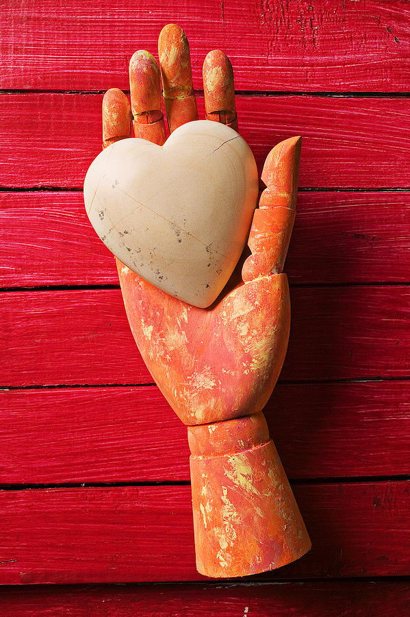 Still Life Photograph - Wooden hand with white heart by Garry Gay