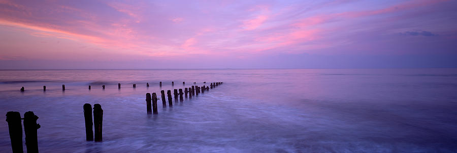 Color Image Photograph - Wooden Posts In Water, Sandsend by Panoramic Images
