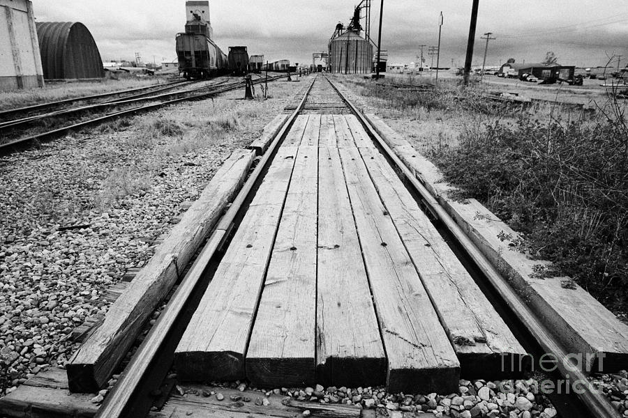 wooden sleepers lying between train track Saskatchewan Canada ...