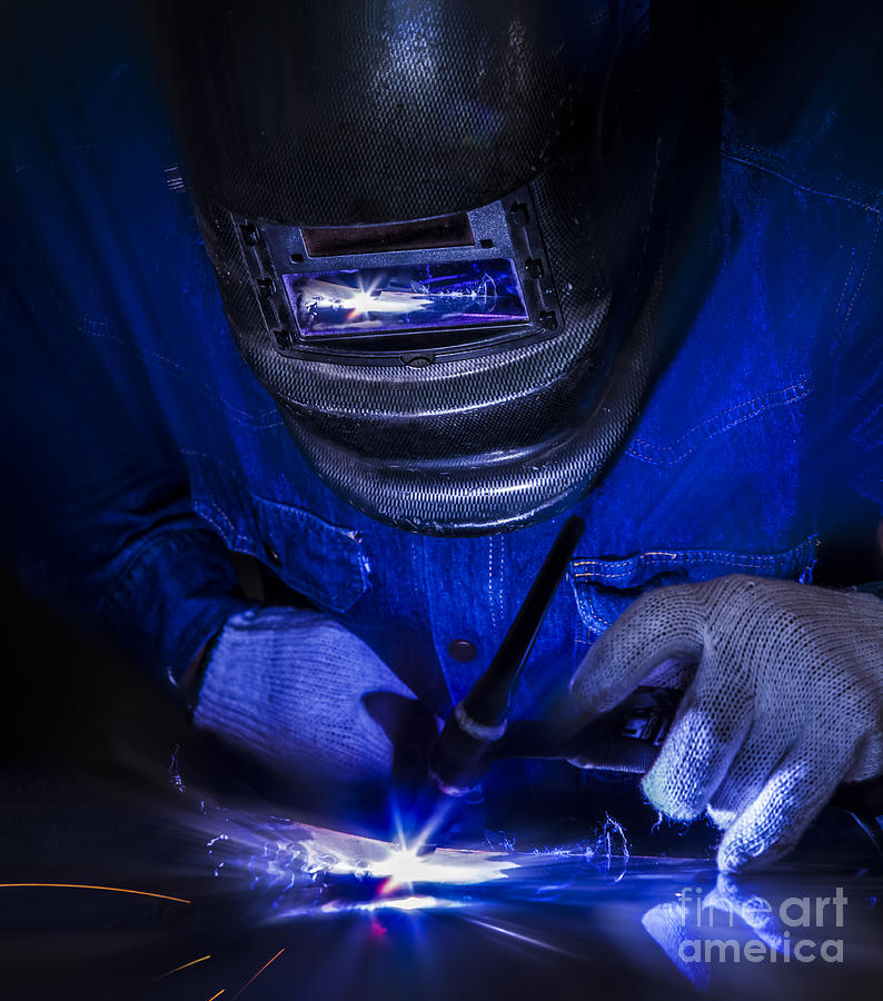 Tool Photograph - Worker welding the steel part by Anek Suwannaphoom