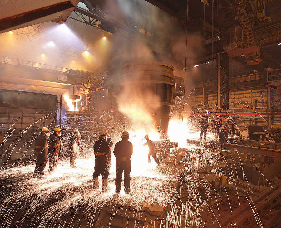 Workers With Molten Steel In Plant Photograph by Monty Rakusen