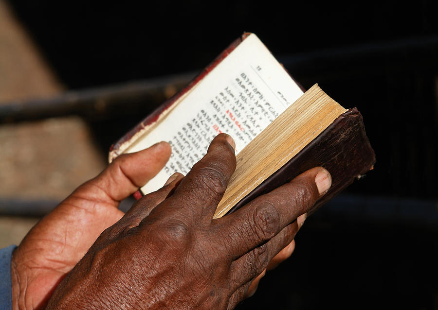Worshipper Reading Holy Bible in Lalibela Ethiopia Photograph by Narvikk