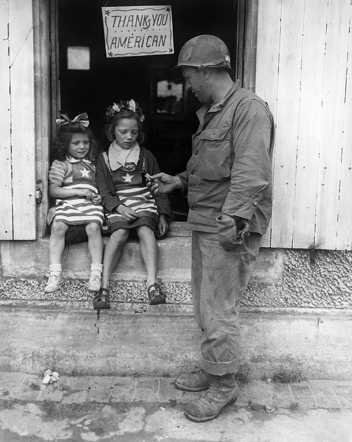 Wwii Soldier And Children Photograph by Granger