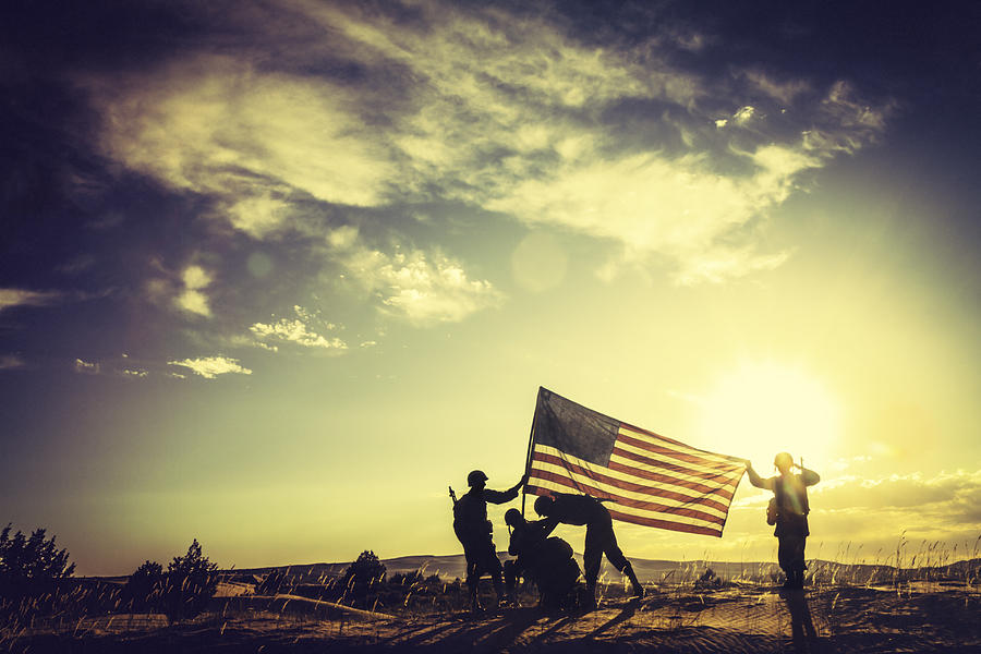 WWII Soldiers Raising The American Flag At Sunset Photograph by Diane Labombarbe