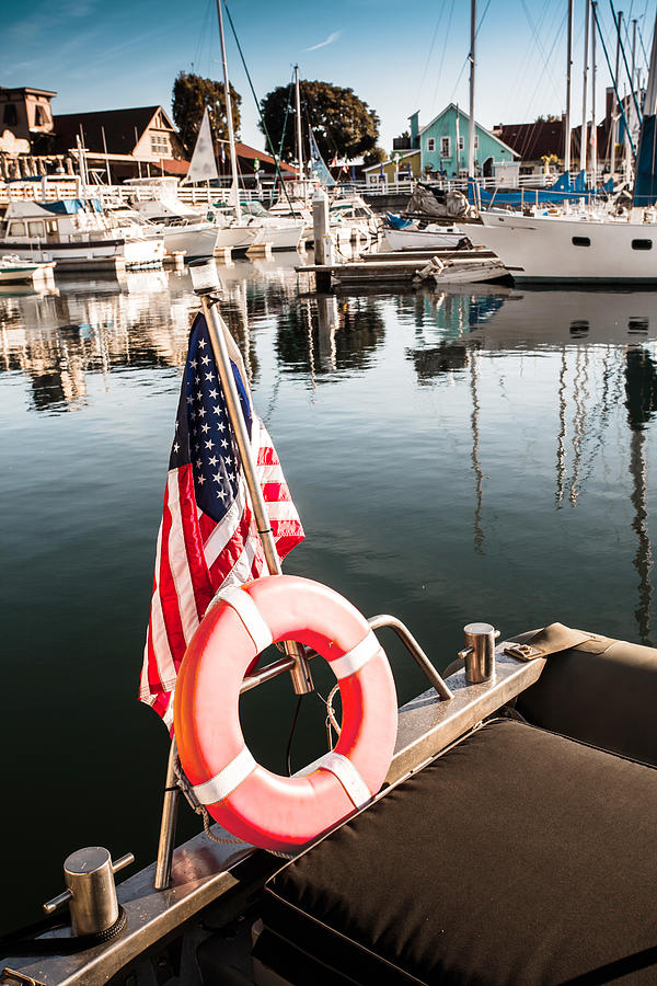 Long Beach Photograph - Yacht with American flag At The Pier  by Sviatlana Kandybovich