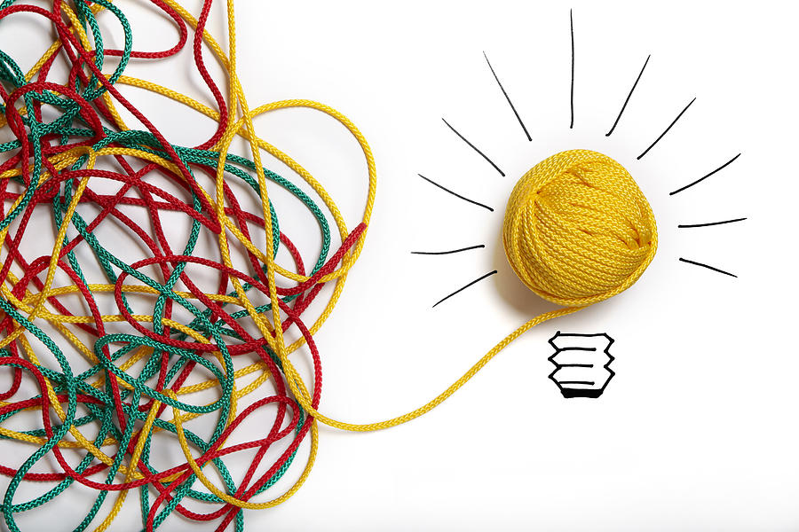 Yellow ball of wool with pen lines like lightbulb Photograph by Xefstock