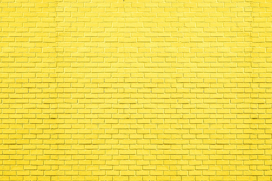 Yellow bricks pattern on wall for abstract background. Photograph by Kundoy