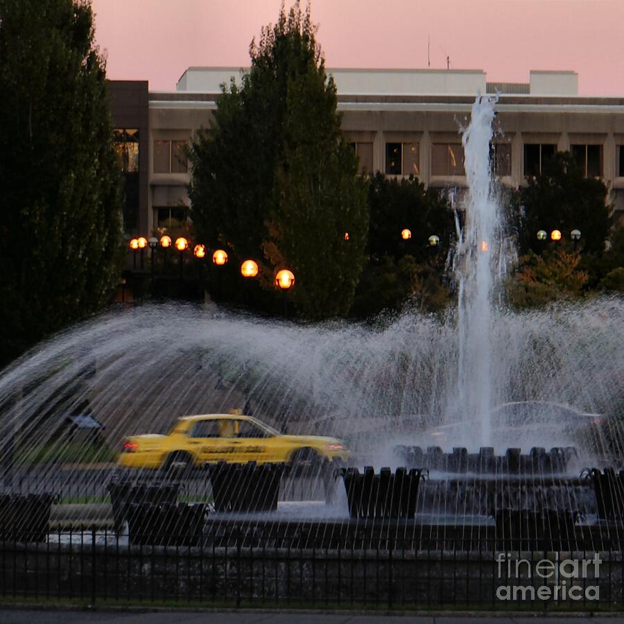 Yellow Cab and Fountain Photograph by Patricia Strand