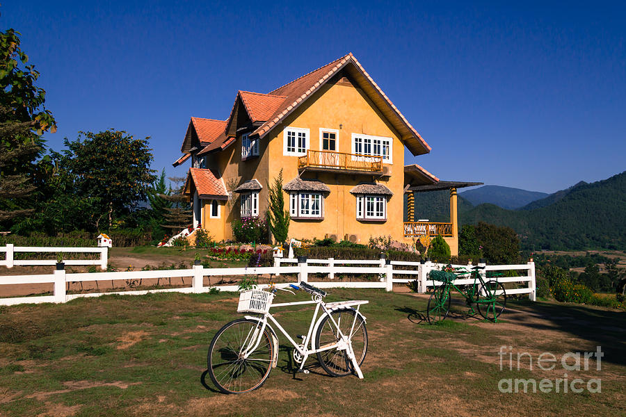 Yellow classic house on hill Photograph by Tosporn Preede