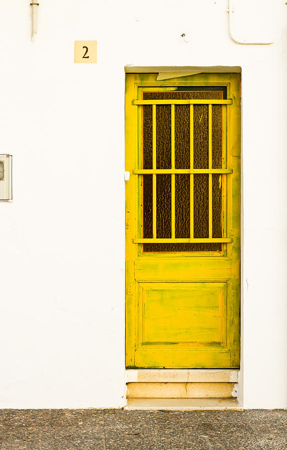 Yellow Door of Catalunya Spain Photograph by Calvin Hanson
