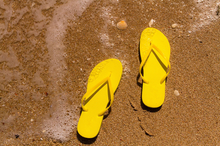 Yellow Flip Flops on the Beach Photograph by Teri Virbickis