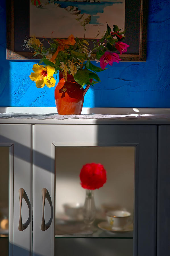 Yellow flower in a vase of clay. Photograph by Juan Carlos Ferro Duque