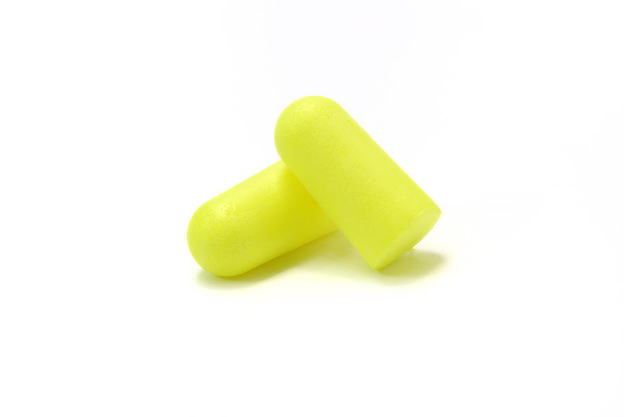 Yellow foam ear plugs Photograph by Jeffoto