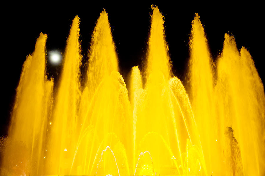 Yellow Fountain At Night Photograph by Raimond Klavins