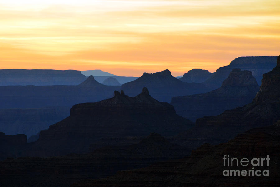 Yellow Orange Sunset Twilight over Silhouetted Spires in Grand Canyon National Park Photograph by Shawn OBrien