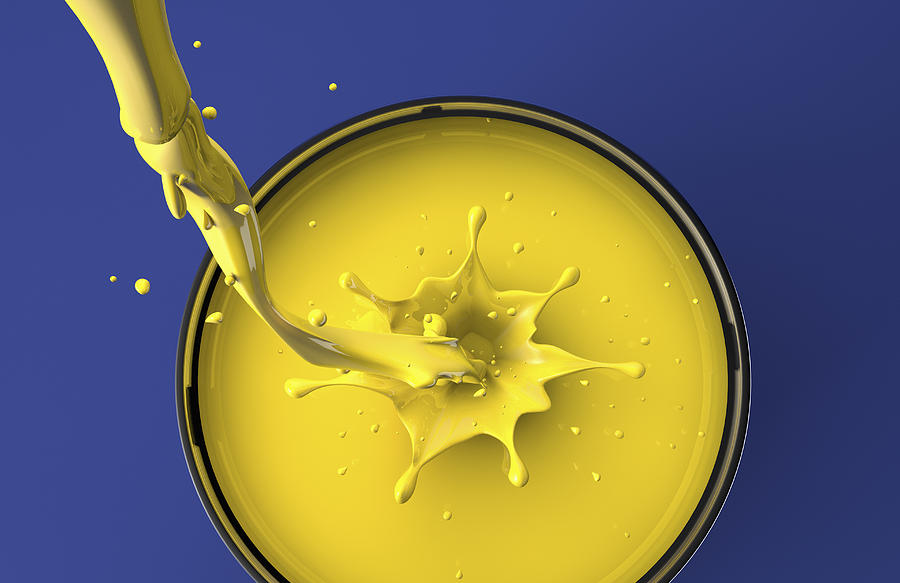 Yellow paint pouring into pot Photograph by Chris Clor