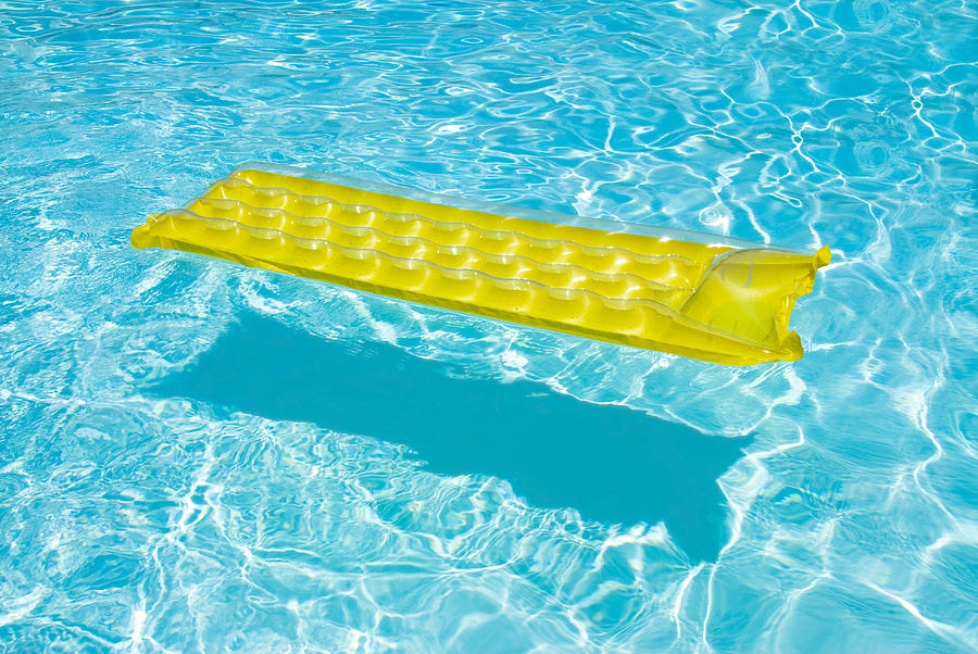 Yellow raft floating in a pool Photograph by Joe Belanger - Fine Art ...