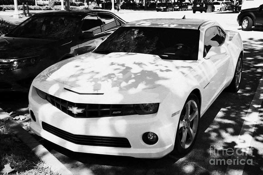 Yellow Ss V8 Chevy Camaro Parked On Street In Celebration Florida Usa  Photograph by Joe Fox - Fine Art America