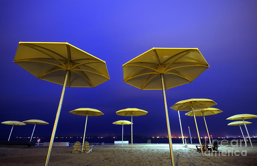 Yellow Umbrellas on Quiet Beach Photograph by Charline Xia