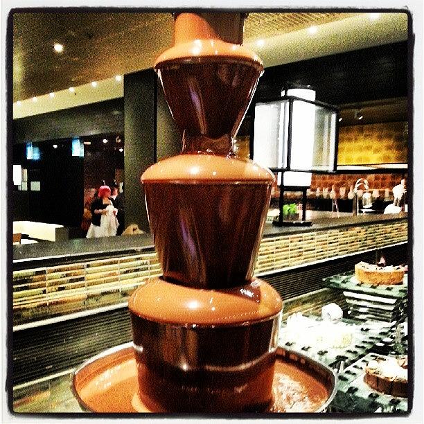 Chocolate Still Life Photograph - Yes.... That Is A Chocolate Fountain! by Krystofer Kot