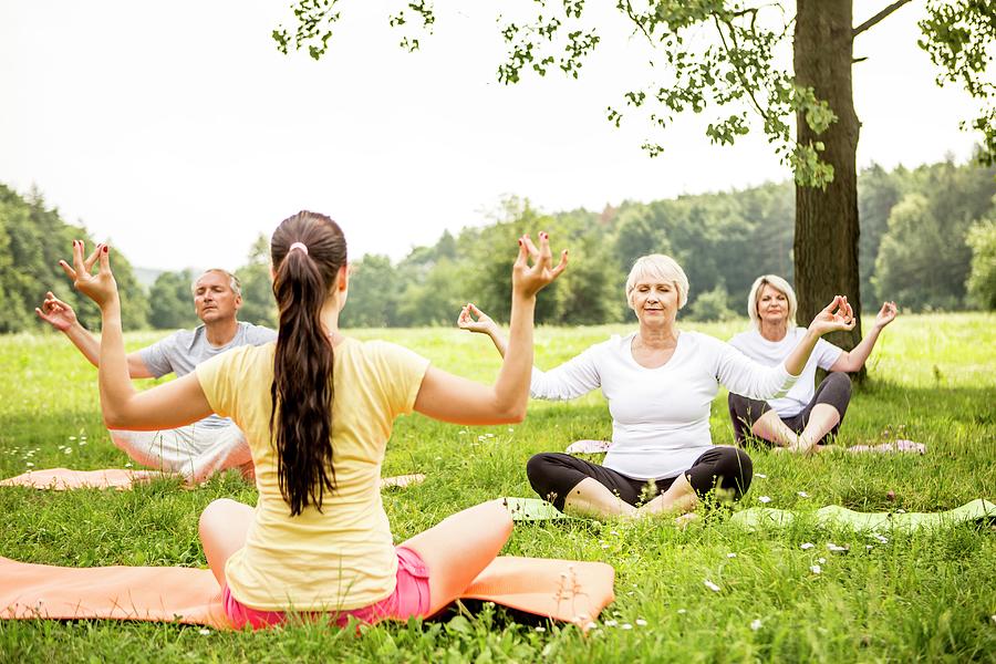 Yoga Class In Field Photograph by Science Photo Library | Fine Art America