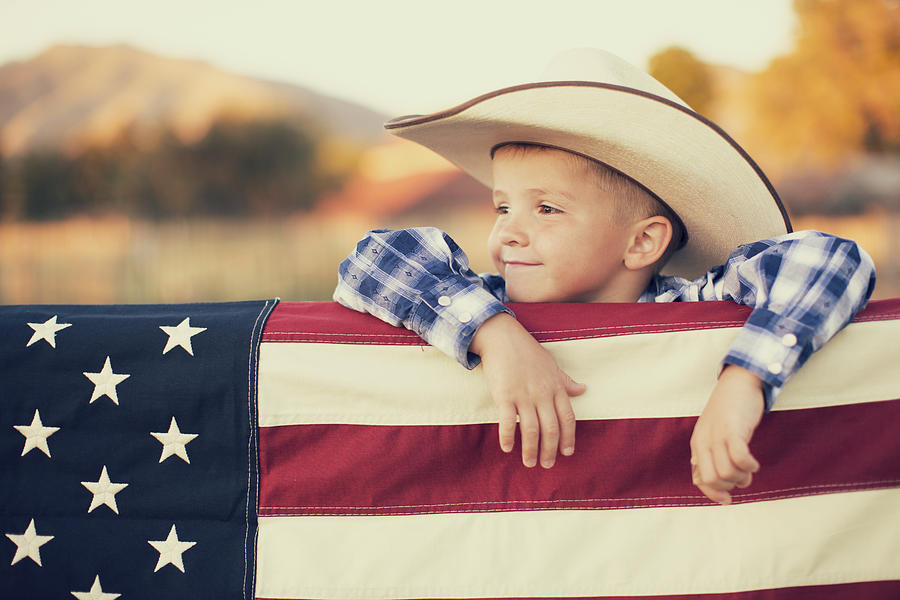 Young American Cowboy with US Flag Photograph by RichVintage