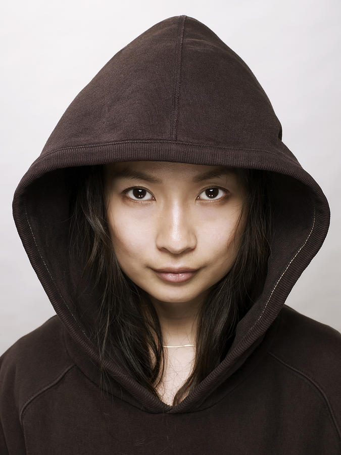 Young asian woman with hooded top Photograph by Ballyscanlon