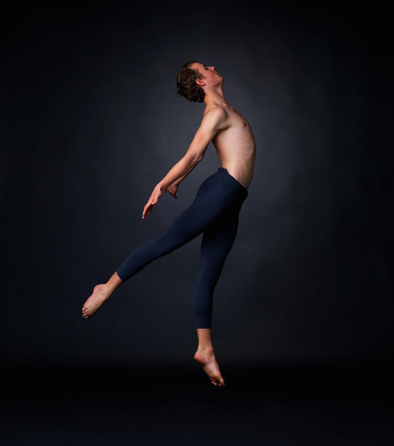 Young Ballet Dancer Performing Against Photograph by Yuri