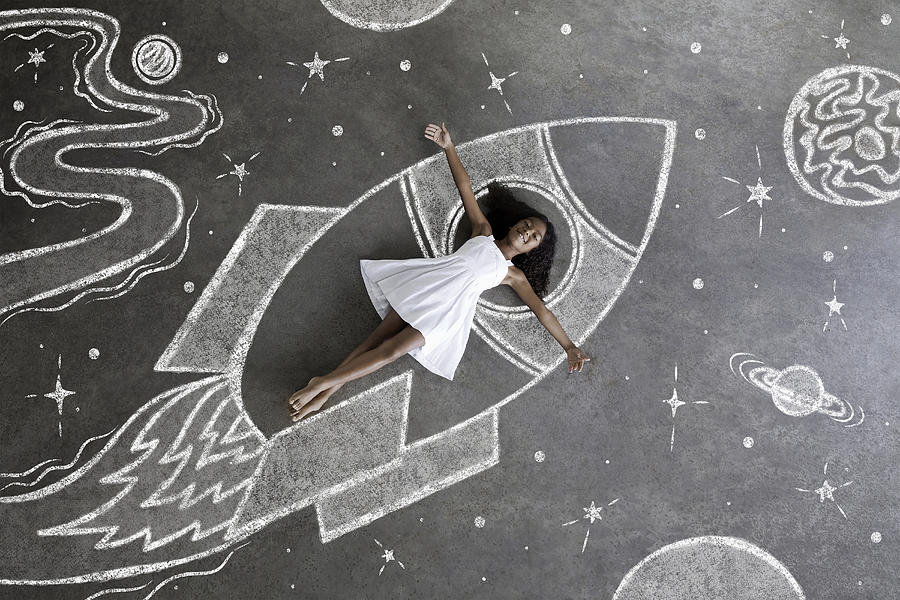 Young black girl, white dress, imaginary spaceship Photograph by Justin Lewis