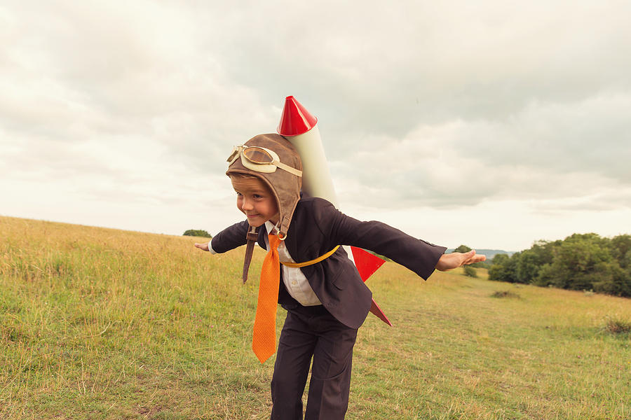 Young Boy Businessman Ready to Launch Rocket Photograph by RichVintage