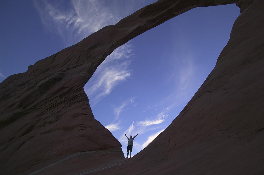 Young Boy In Sandstone Window Rock Arch Photograph by Mark Harmel