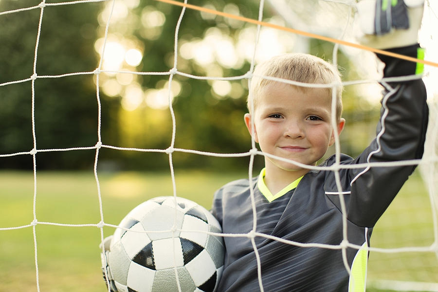 Young Boy Soccer Goalie Stands holding Ball Photograph by RichVintage