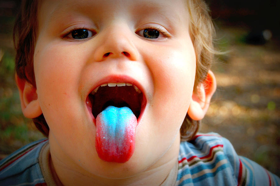 Young boy sticking out a blue tongue Photograph by Meredith Winn Photography