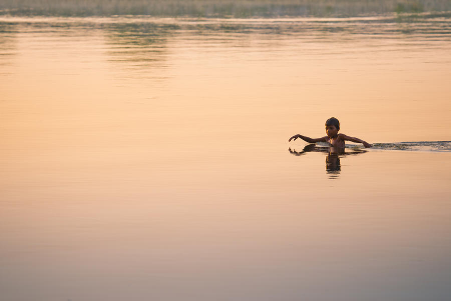 Nature Photograph - Young Boy Swimming in Clear Waters by Nila Newsom