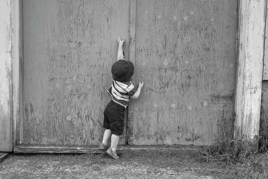 Young Boy Trying To Open Barn Door Photograph by David Chapman