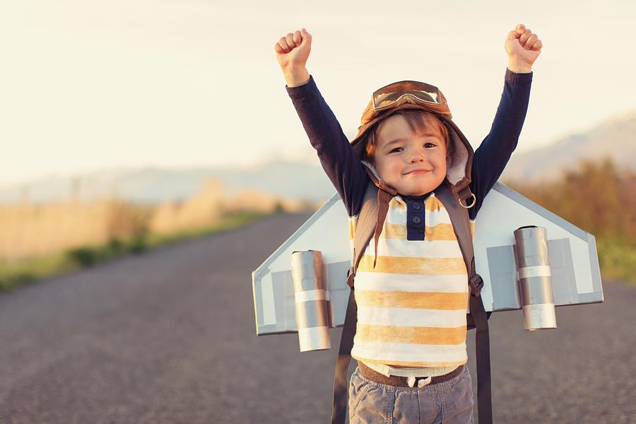 Young Boy with Jet Pack with Arms Raised Photograph by RichVintage