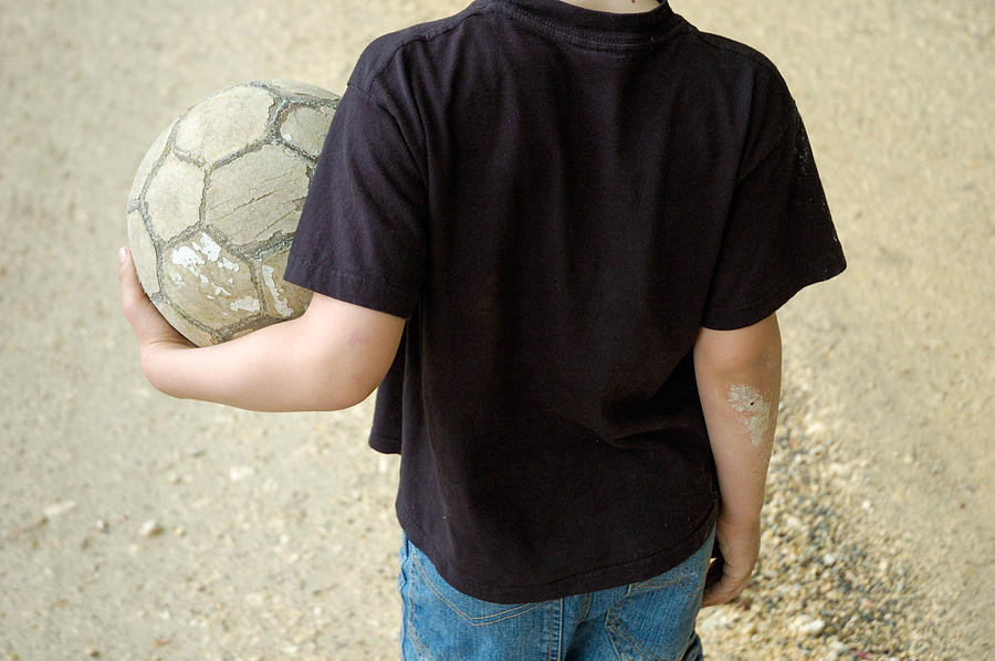 Young boy with soccer ball Photograph by Matthias Hauser