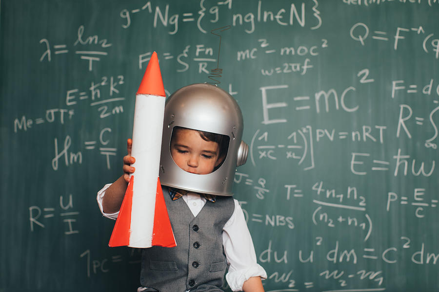Young Business Boy with Space Helmet and Rocket Photograph by RichVintage