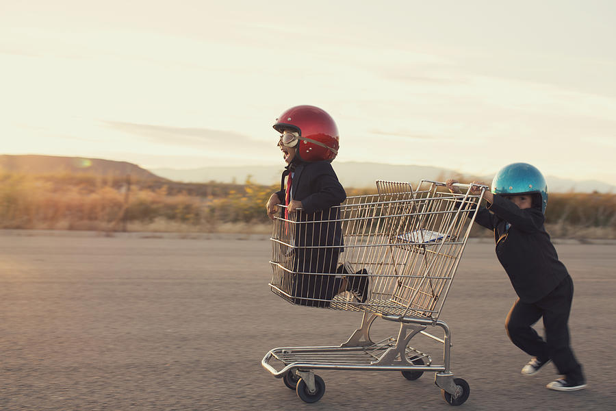 Young Business Boys Race in Shopping Cart Photograph by RichVintage