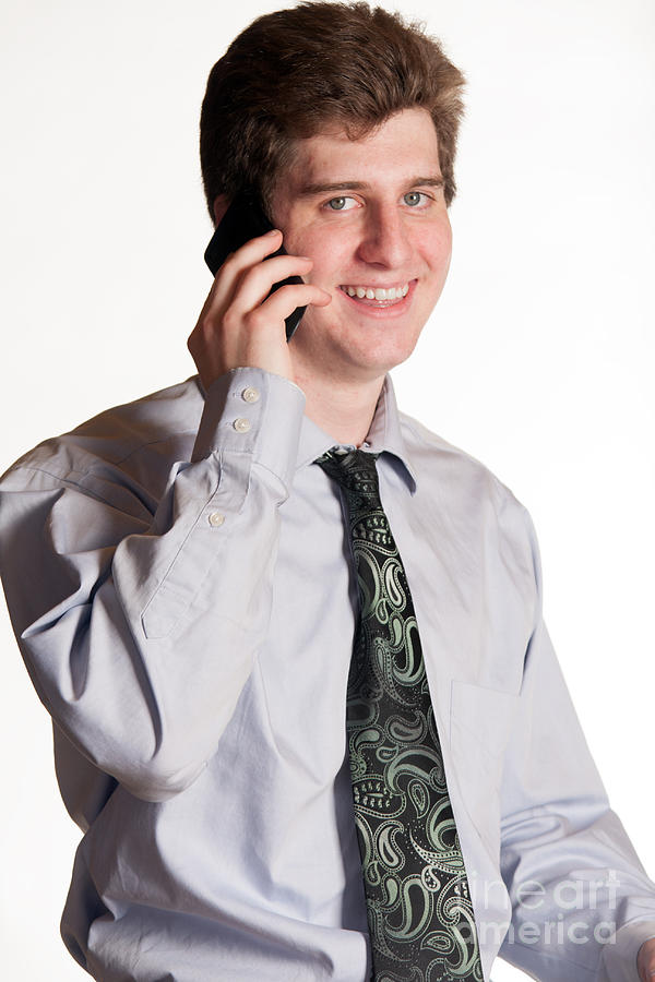 Portrait Photograph - Young Business Man On Cell Phone by Gunter Nezhoda